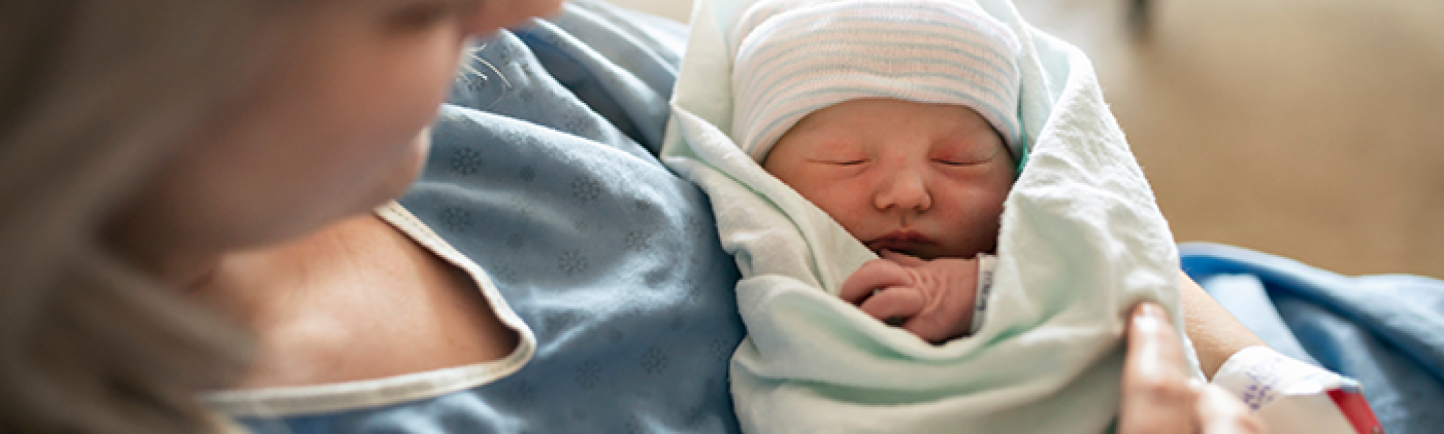 mom holding newborn baby
