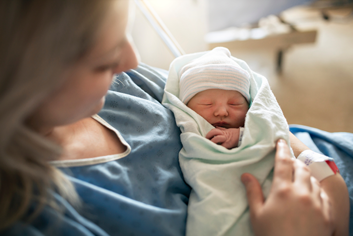 mom holding newborn baby