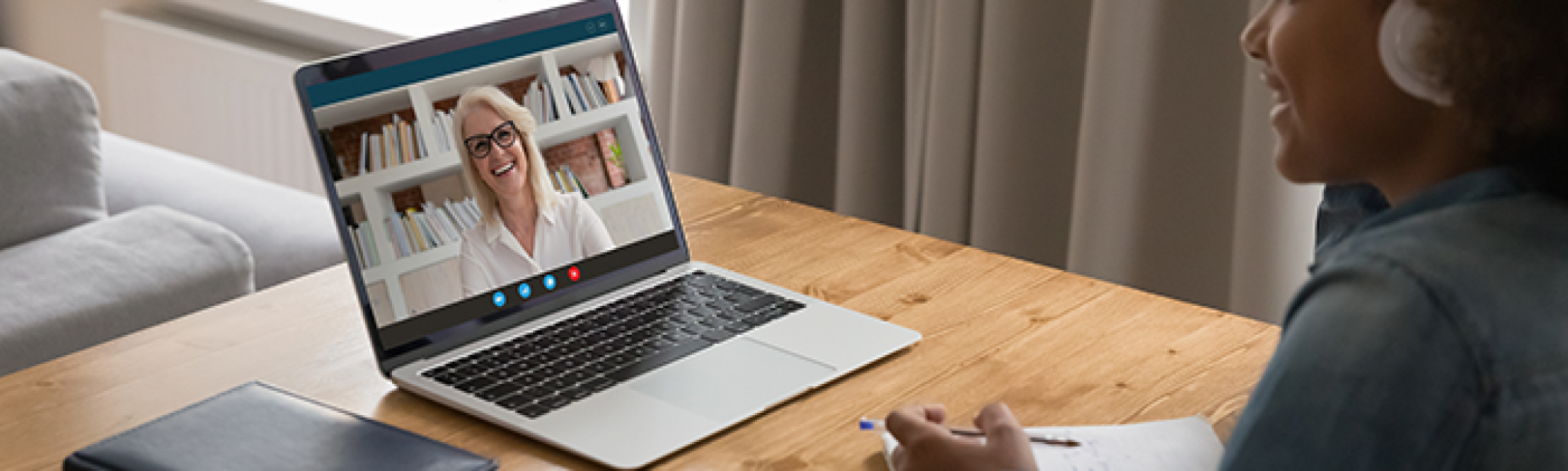 student on laptop having telehealth visit