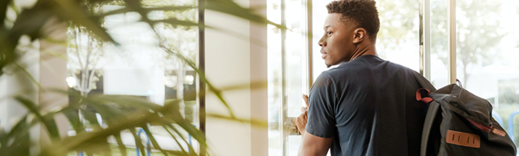 Student walking into a facility