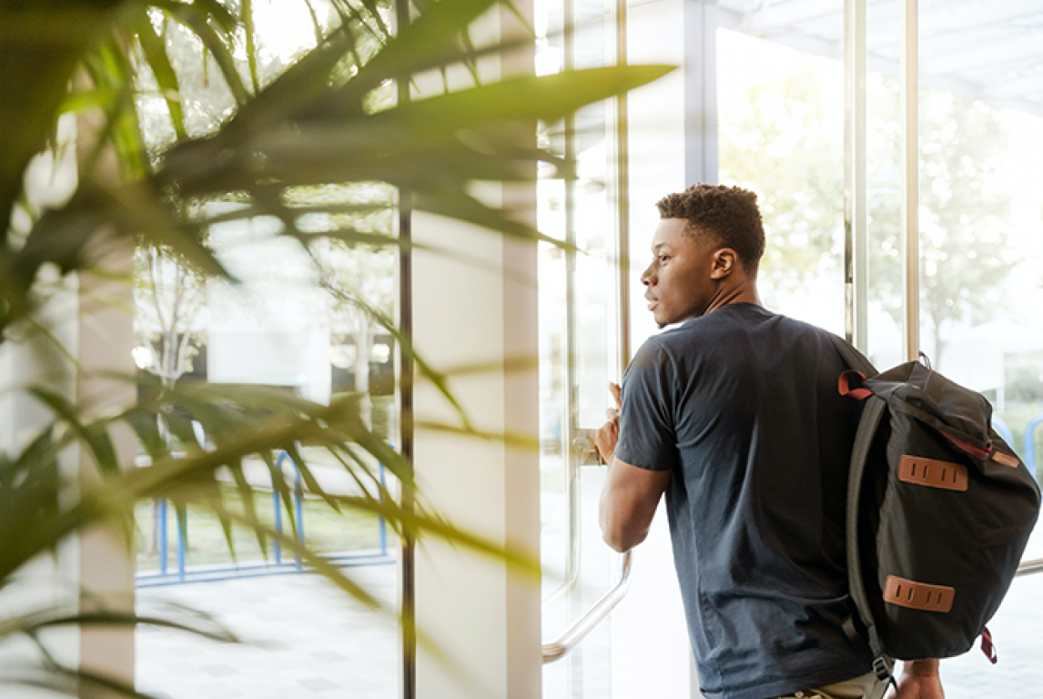 Student walking into a facility